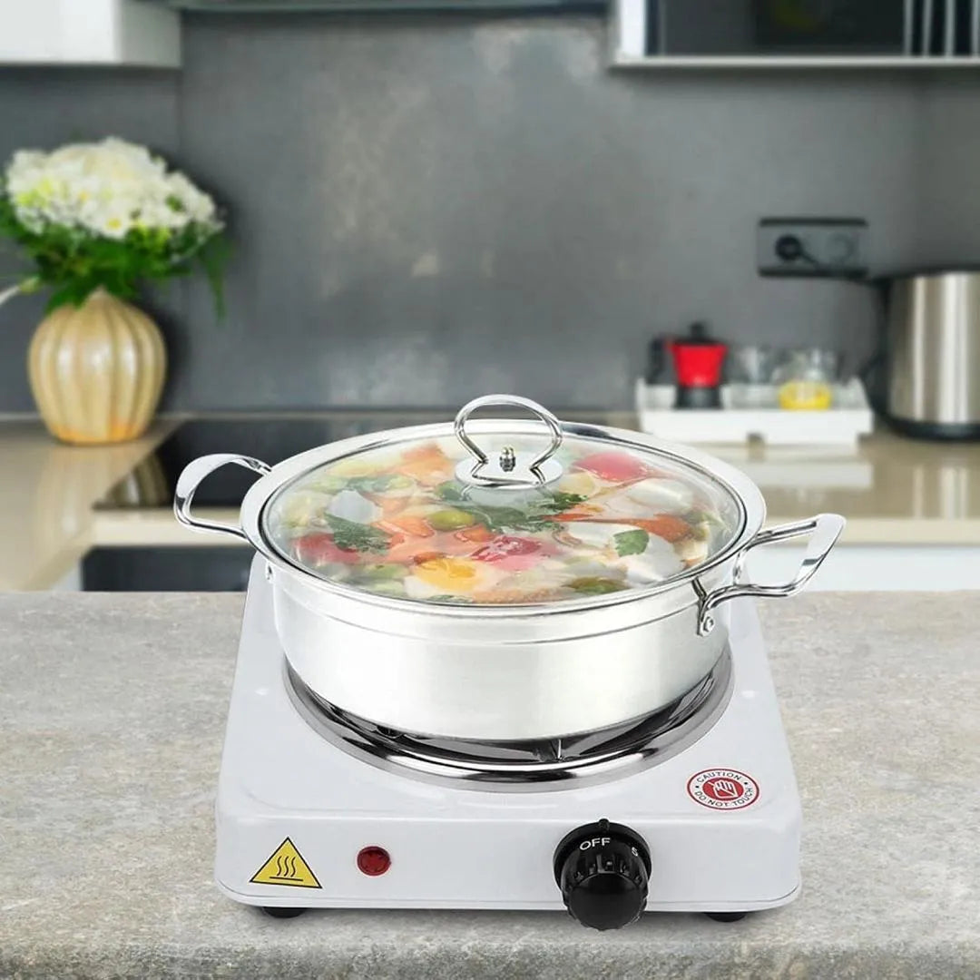 Electric hot plate with a pot of food on a kitchen counter